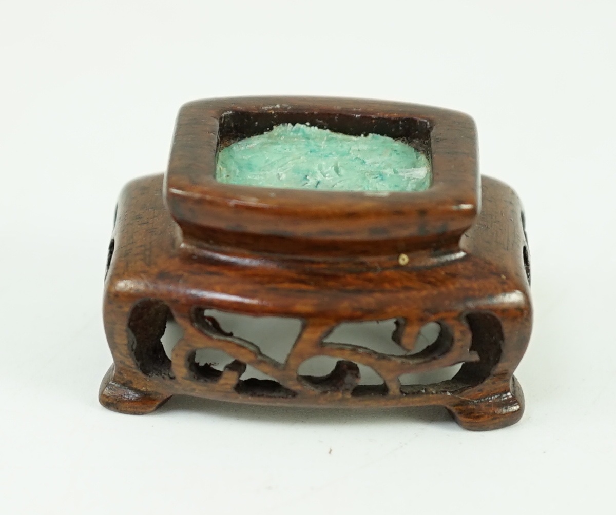 A Chinese archaistic green and russet jade miniature vase and cover, fanghu, 19th century, 6.7 cm high, foot re-carved, wood stand